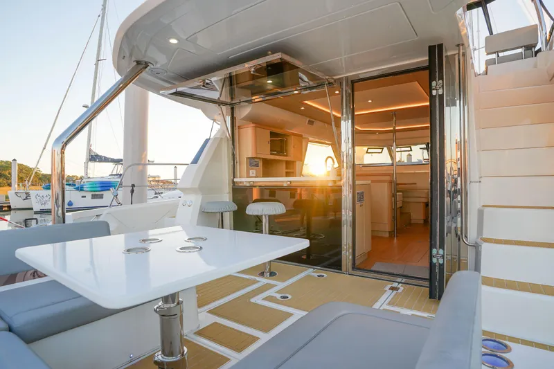 Slide: The Image of Aquila 44 Yacht 2021 interior with modern design and sunset view. - 35