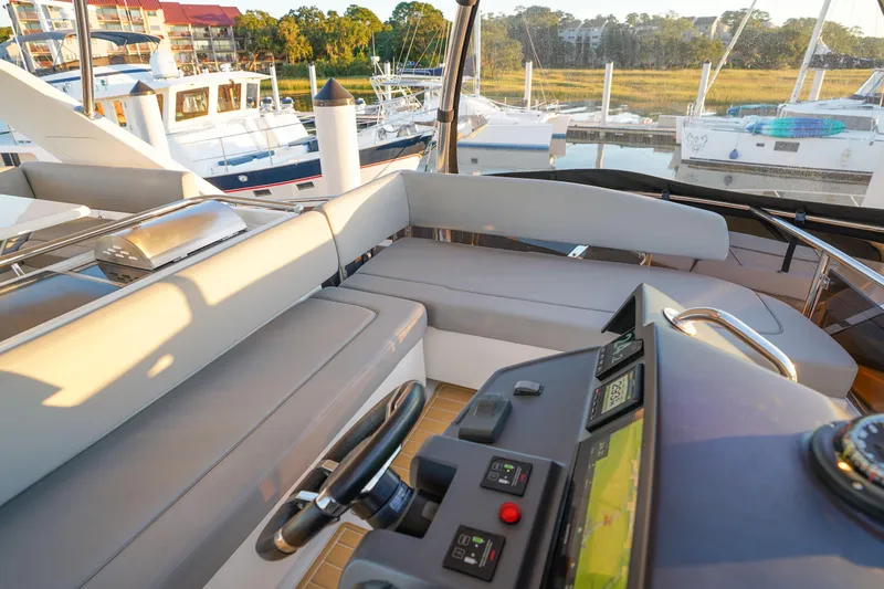 Slide: The Image of Luxurious 2021 Aquila 44 Yacht interior with modern helm and comfortable seating. - 47