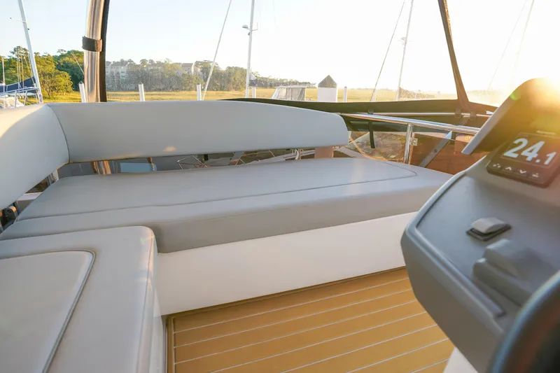 Slide: The Image of Interior view of 2021 Aquila 44 Yacht with seating and control panel. - 48