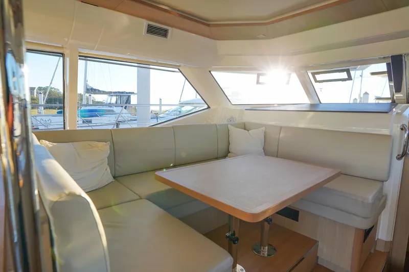 Slide: The Image of Luxurious interior of 2021 Aquila 44 Yacht with sunlit seating area. - 9