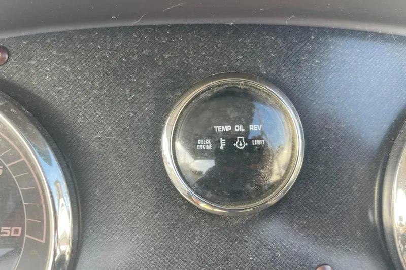 Slide: The Image of Dashboard gauge of 2023 Godfrey Sweetwater 2086 SB showing temperature, oil, and rev indicators. - 15