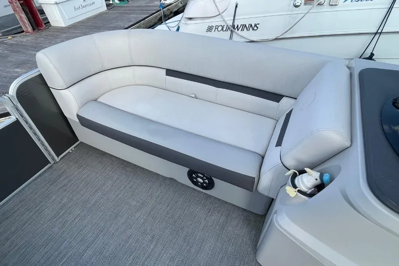 Slide: The Image of 2023 Godfrey Sweetwater 2086 SB boat interior with comfortable seating and modern design. - 19