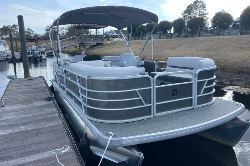Slide: The Image of 2023 Godfrey Sweetwater 2086 SB pontoon boat docked at a marina. - 2