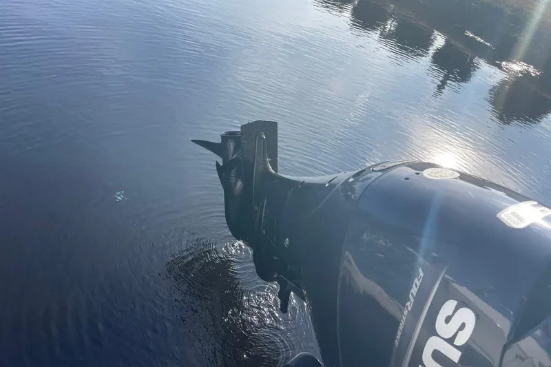 Slide: The Image of Outboard motor of 2023 Godfrey Sweetwater 2086 SB on calm water. - 29