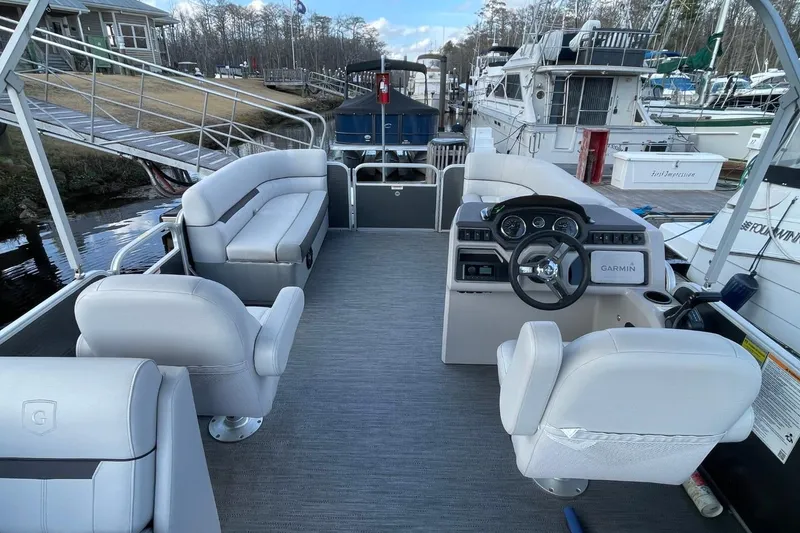 Slide: The Image of 2023 Godfrey Sweetwater 2086 SB pontoon boat interior with helm and seating. - 7