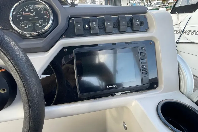 Slide: The Image of Dashboard of 2023 Godfrey Sweetwater 2086 SB with Garmin display and controls. - 9