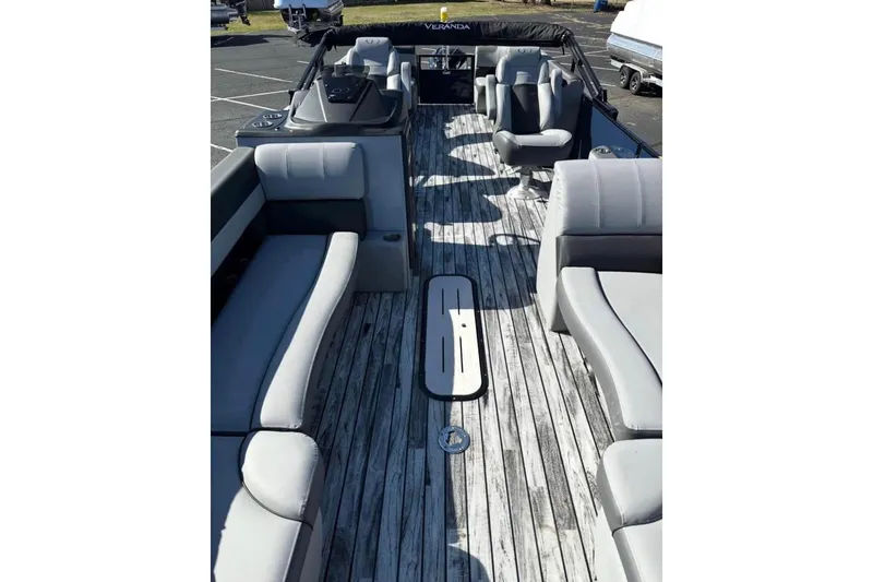 Slide: The Image of 2025 Veranda Relax VR25RC pontoon boat with spacious seating and stylish deck design. - 11