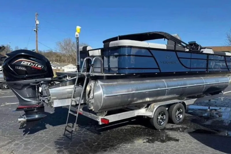 Slide: The Image of 2025 Veranda Relax VR25RC pontoon boat with Yamaha engine on trailer. - 4