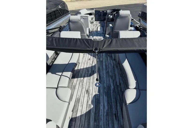 Slide: The Image of 2025 Veranda Relax VR25RC pontoon boat with sleek seating and modern design. - 8