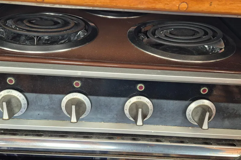 Slide: The Image of Interior of 1983 Grand Banks 42 Classic yacht kitchen with wooden cabinetry and appliances. - 11