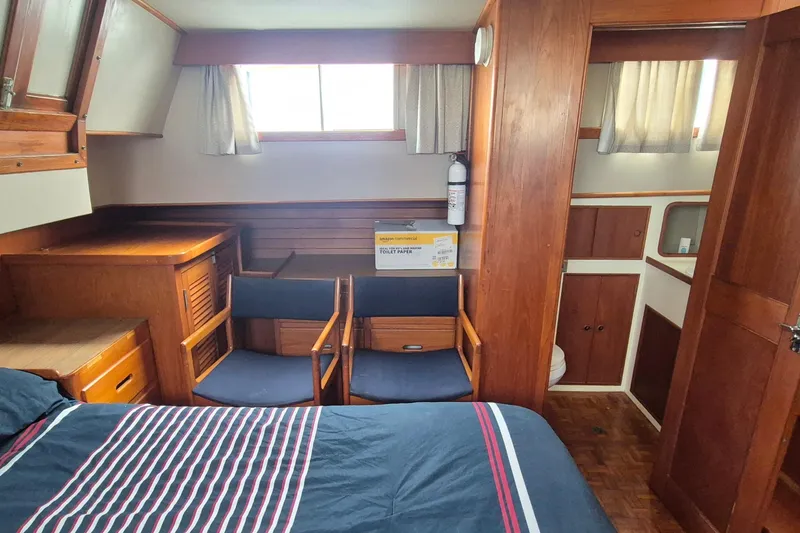 Slide: The Image of Cozy cabin interior of 1983 Grand Banks 42 Classic yacht with bed and wooden furnishings. - 15