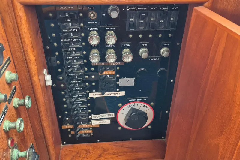Slide: The Image of Electrical panel of 1983 Grand Banks 42 Classic yacht with switches and controls. - 26