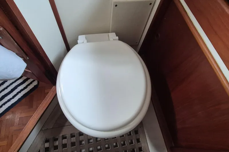 Slide: The Image of Electrical panel inside a 1983 Grand Banks 42 Classic yacht, featuring various switches and controls. - 29