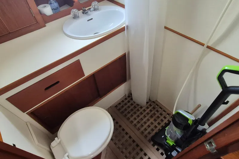 Slide: The Image of Toilet in 1983 Grand Banks 42 Classic yacht, featuring wooden interior details. - 30