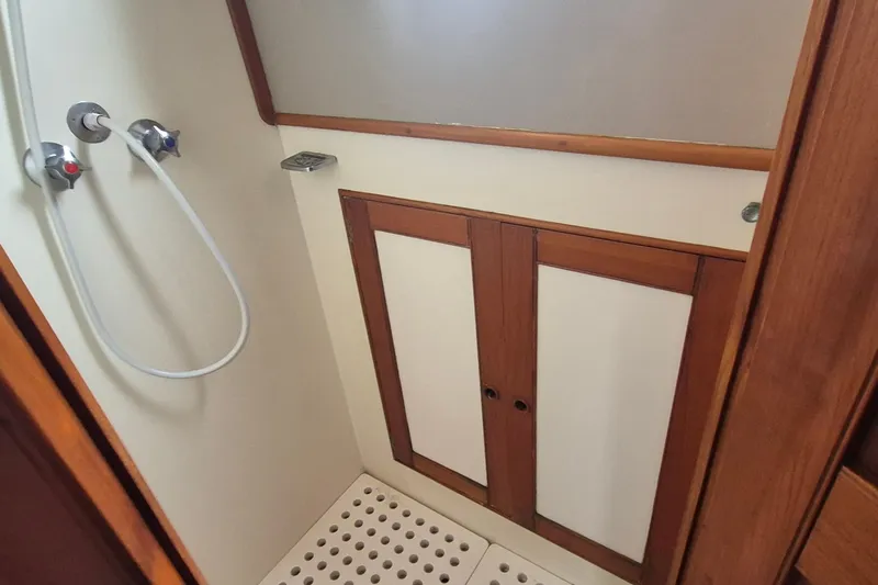 Slide: The Image of Interior view of 1983 Grand Banks 42 Classic boat with wooden trim and ceiling hatch. - 32