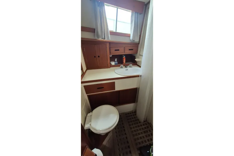 Slide: The Image of Shower area in 1983 Grand Banks 42 Classic yacht with wooden cabinetry. - 33