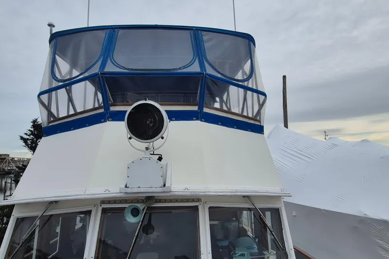 Slide: The Image of Bathroom interior of 1983 Grand Banks 42 Classic yacht, featuring wooden cabinetry and a compact design. - 34