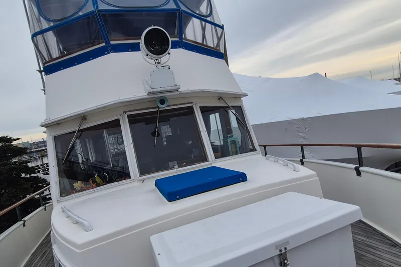 Slide: The Image of Bow of 1983 Grand Banks 42 Classic yacht with anchor and chain. - 37