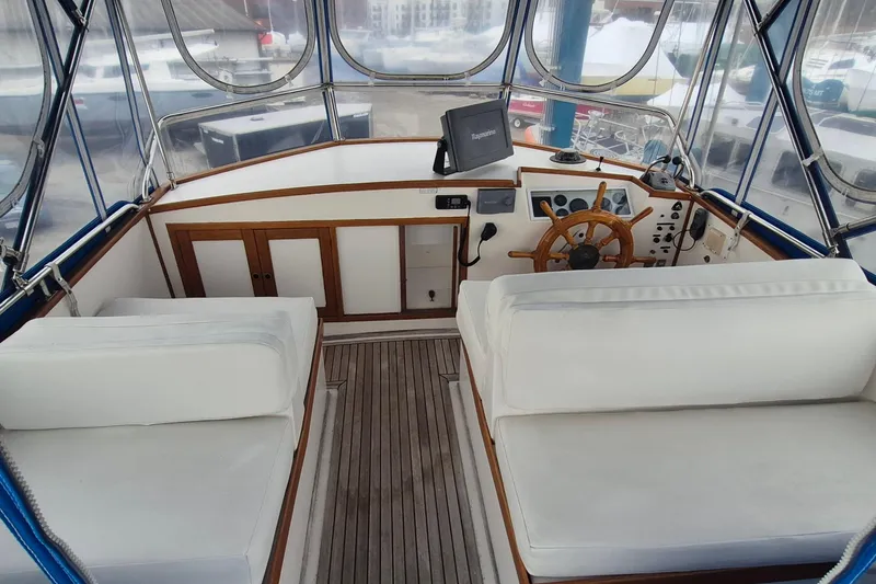 Slide: The Image of Wicker furniture on the deck of a 1983 Grand Banks 42 Classic yacht. - 42