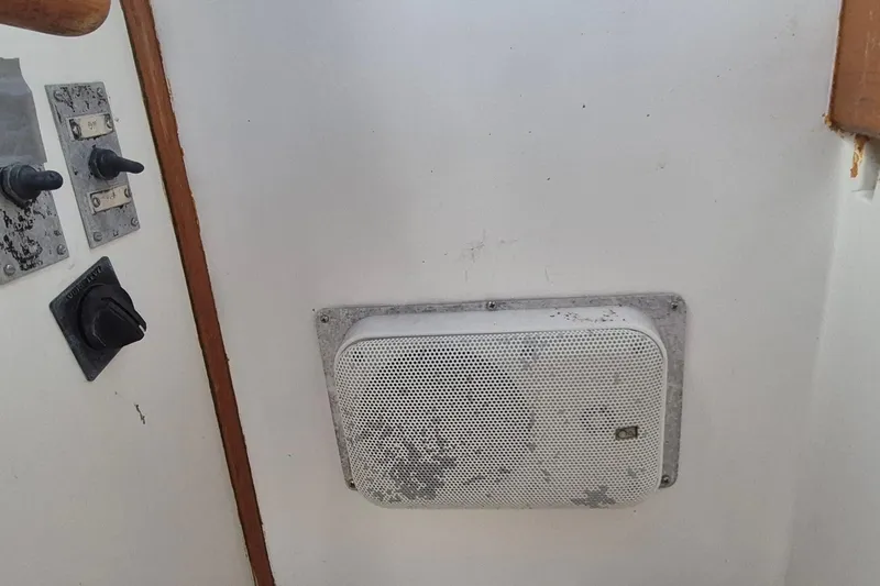 Slide: The Image of 1983 Grand Banks 42 Classic boat with blue canopy and lifebuoy. - 50