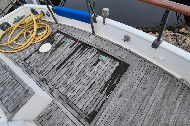 Slide: The Image of Weathered wooden deck of 1983 Grand Banks 42 Classic boat. - 55