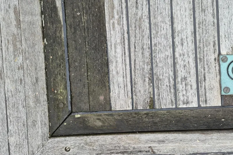 Slide: The Image of 1983 Grand Banks 42 Classic engine compartment with fuel tanks and hoses visible. - 57