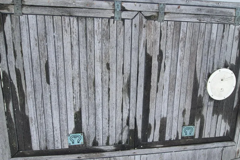 Slide: The Image of Weathered wooden deck of 1983 Grand Banks 42 Classic boat. - 58