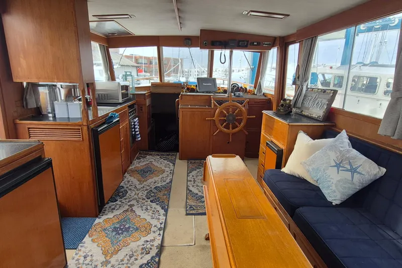 Slide: The Image of Interior of 1983 Grand Banks 42 Classic yacht with wooden furnishings and nautical decor. - 6