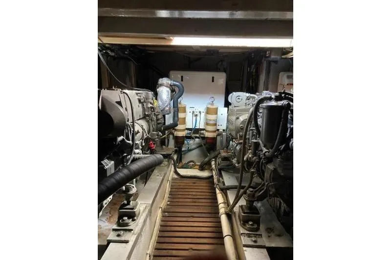 Slide: The Image of Engine room of a 1983 Grand Banks 42 Classic yacht, showcasing dual engines. - 67