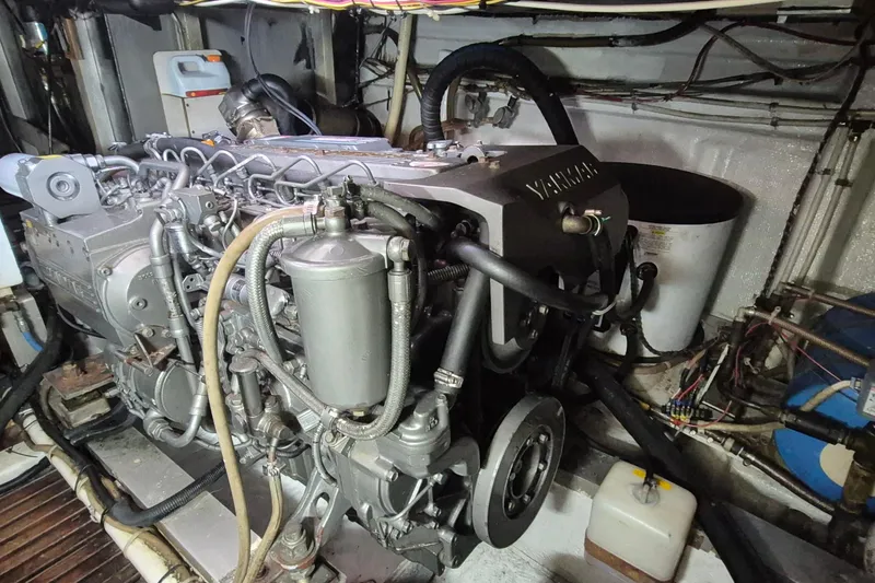 Slide: The Image of Engine mount of a 1983 Grand Banks 42 Classic boat, showing bolts and wiring. - 70