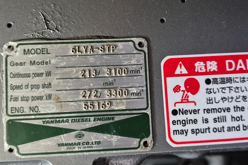 Slide: The Image of Engine room of a 1983 Grand Banks 42 Classic yacht, featuring a detailed engine view. - 72