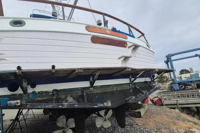 Slide: The Image of Underside of 1983 Grand Banks 42 Classic with twin propellers on dry dock. - 77