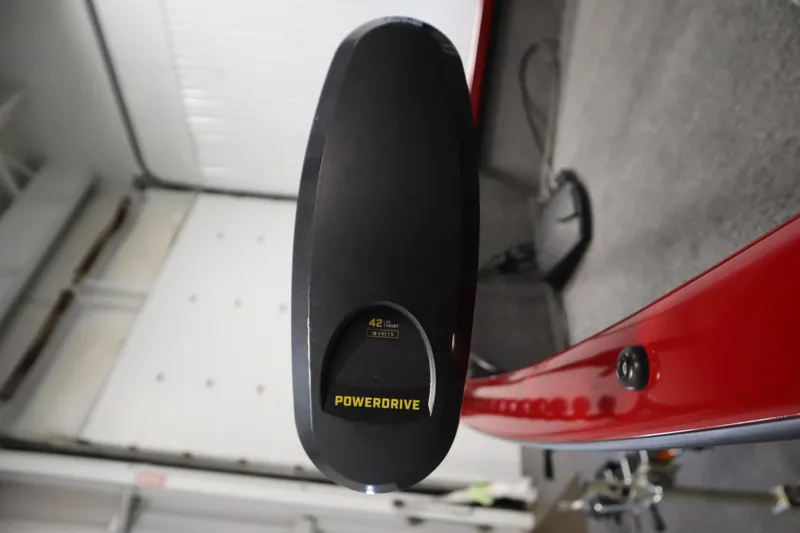 Slide: The Image of 2024 Tracker Pro Guide V-16 WT boat with PowerDrive motor, red interior detail. - 12