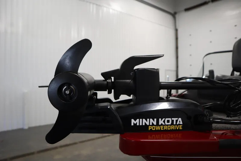 Slide: The Image of 2024 Tracker Pro Guide V-16 WT with Minn Kota PowerDrive motor in a garage setting. - 13