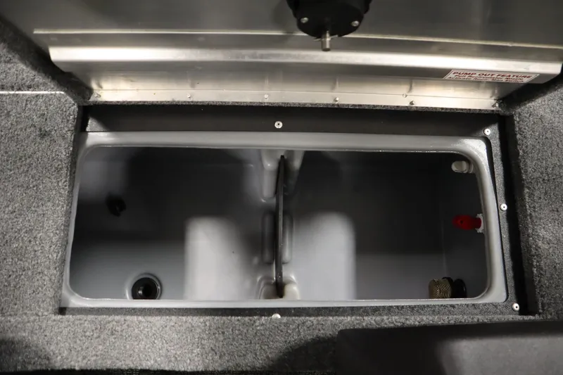 Slide: The Image of 2024 Tracker Pro Guide V-16 WT livewell interior with gray finish and pump-out feature. - 21