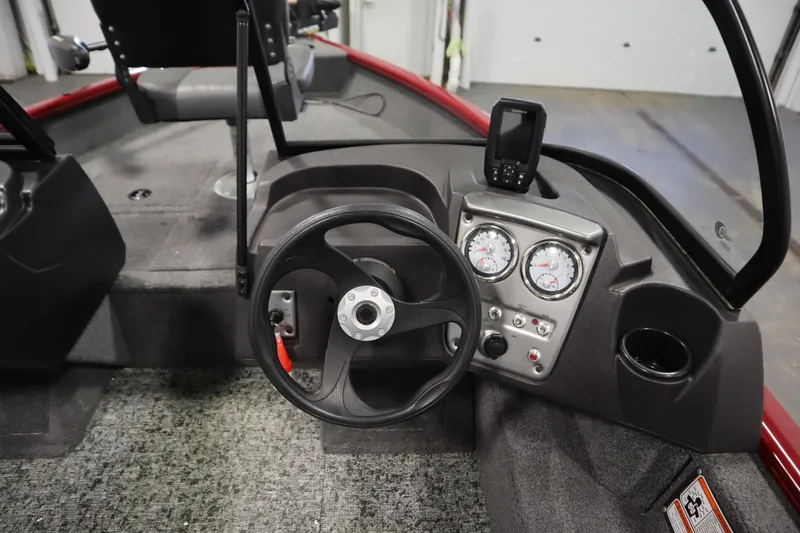 Slide: The Image of 2024 Tracker Pro Guide V-16 WT boat dashboard with steering wheel and gauges. - 23