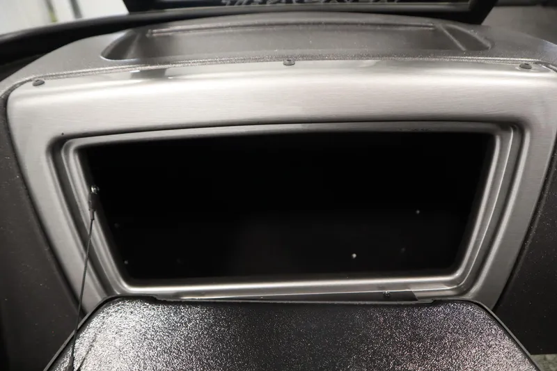 Slide: The Image of 2024 Tracker Pro Guide V-16 WT dashboard compartment, open and empty. - 30