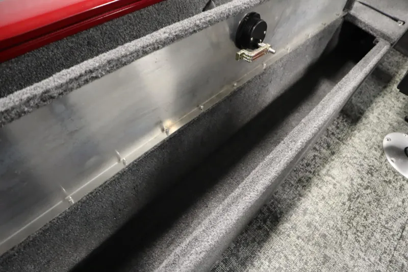 Slide: The Image of 2024 Tracker Pro Guide V-16 WT interior storage compartment with carpeted finish. - 34