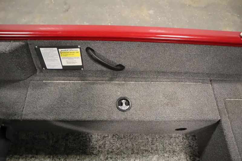 Slide: The Image of 2024 Tracker Pro Guide V-16 WT interior with capacity label and storage compartment. - 35