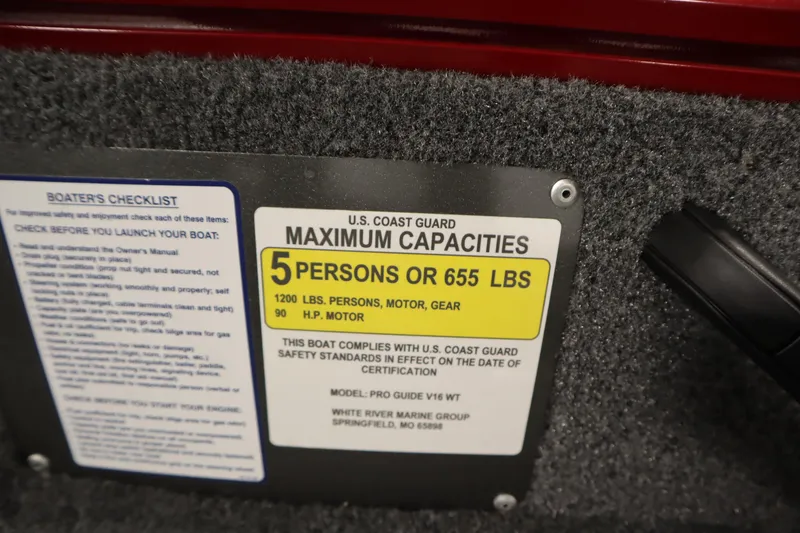 Slide: The Image of 2024 Tracker Pro Guide V-16 WT capacity label, 5 persons or 655 lbs, U.S. Coast Guard compliant. - 37