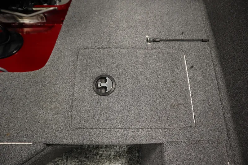 Slide: The Image of 2024 Tracker Pro Guide V-16 WT boat interior with carpeted storage compartment. - 40