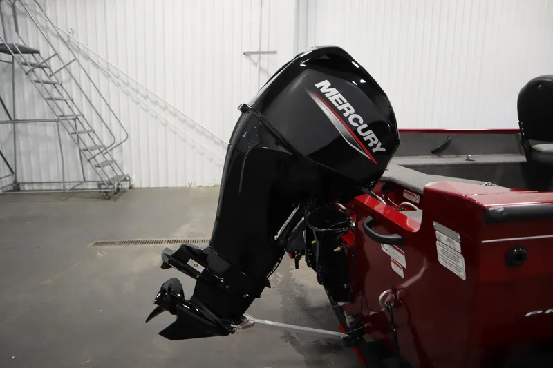 Slide: The Image of 2024 Tracker Pro Guide V-16 WT boat with Mercury outboard motor in a showroom. - 45