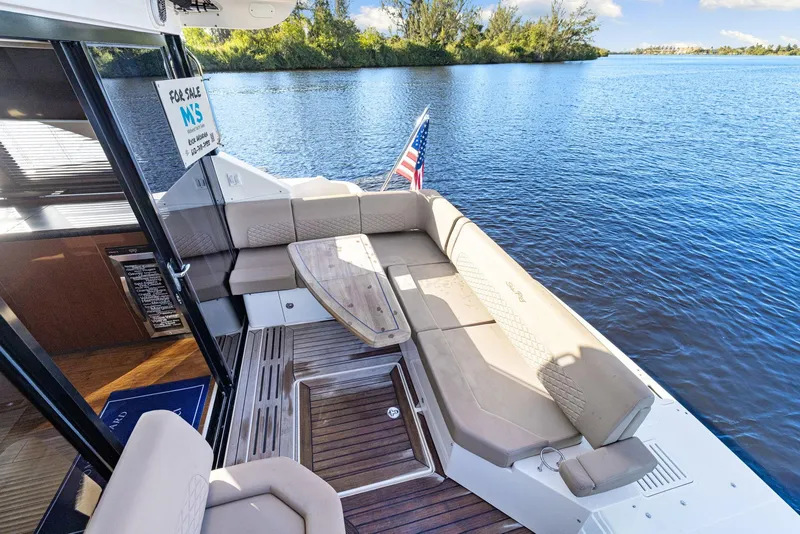 Slide: The Image of 2017 Sea Ray 460 Sundancer yacht with spacious deck seating and scenic water view. - 20