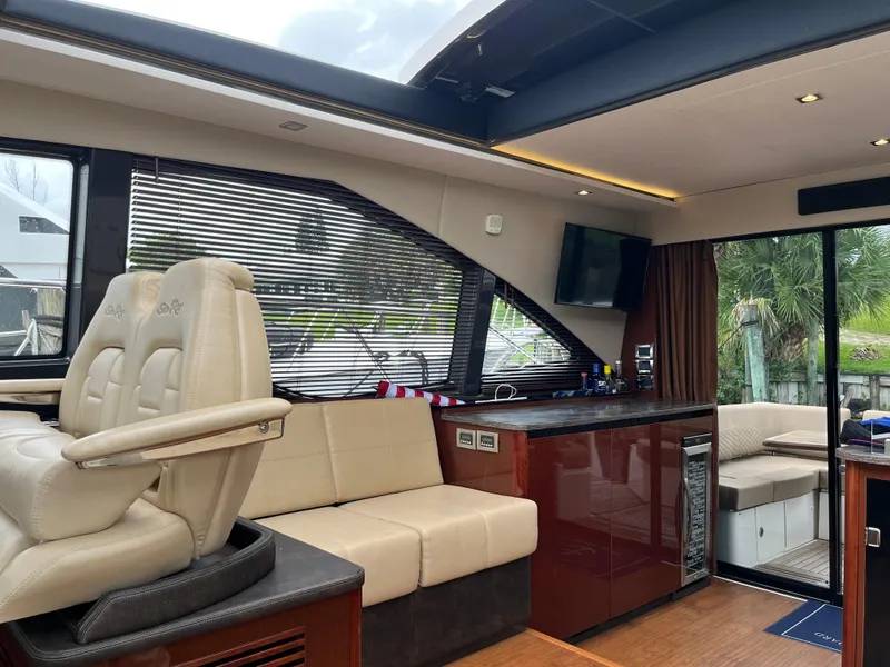 Slide: The Image of Interior of a 2017 Sea Ray Sundancer 460 yacht with luxurious seating area. - 37