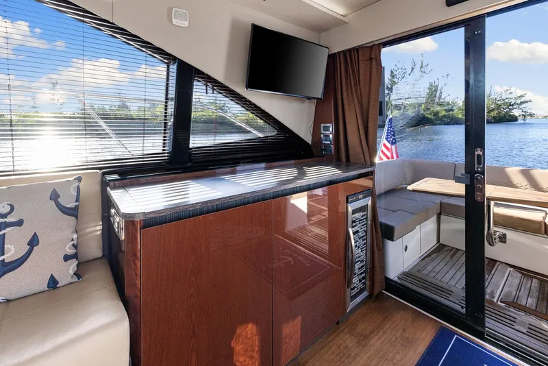 Slide: The Image of Interior of 2017 Sea Ray 460 Sundancer yacht with modern amenities and scenic water view. - 41