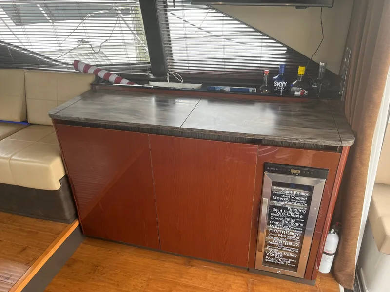 Slide: The Image of Interior of 2017 Sea Ray Sundancer 460 yacht with minibar and seating area. - 43