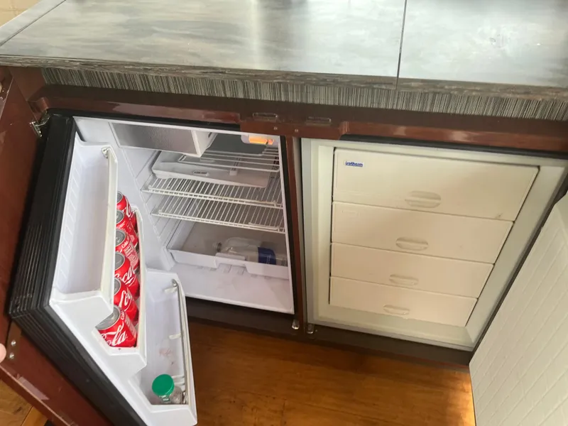 Slide: The Image of Open fridge on a 2017 Sea Ray Sundancer 460 yacht. - 46