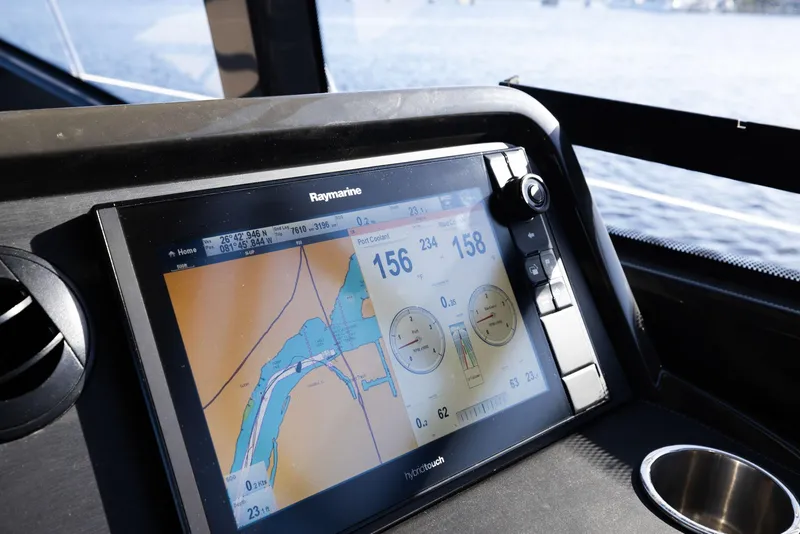 Slide: The Image of Raymarine navigation display on 2017 Sea Ray 460 Sundancer boat, showing map and data. - 78