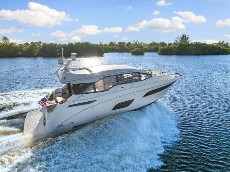 Slide: The Image of 2017 Sea Ray 460 Sundancer yacht cruising on a sunny day. - 8