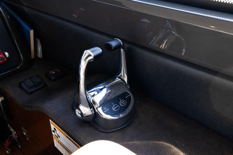 Slide: The Image of Throttle controls on 2017 Sea Ray 460 Sundancer yacht dashboard. - 83